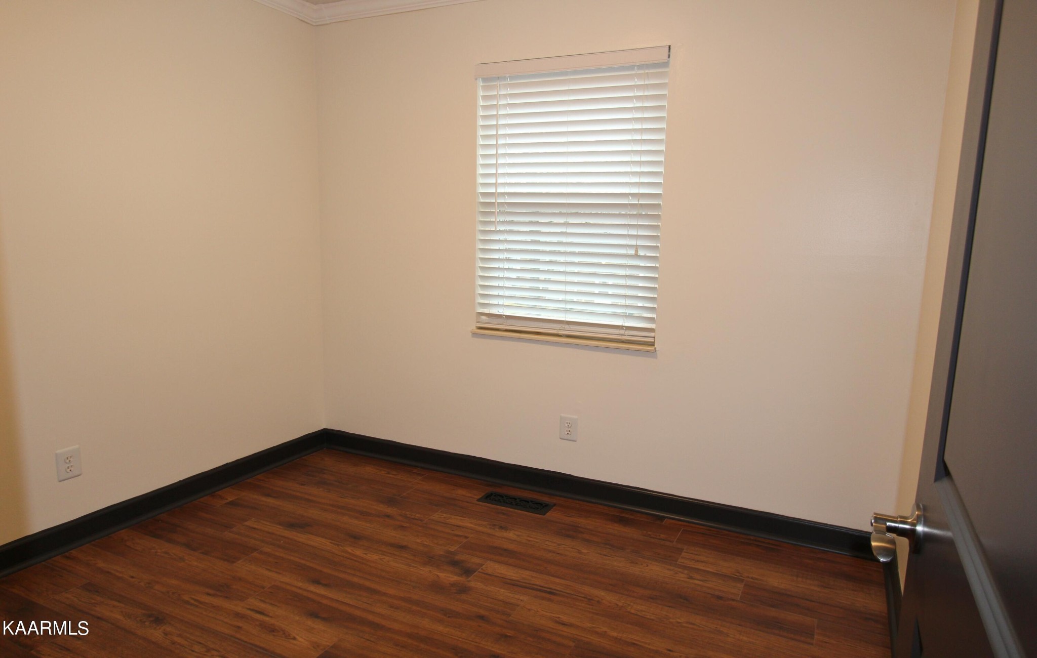 4222 Abercorn Road Knoxville, TN 37921 - Photo 12 of 33 an empty room with wooden floor and windows