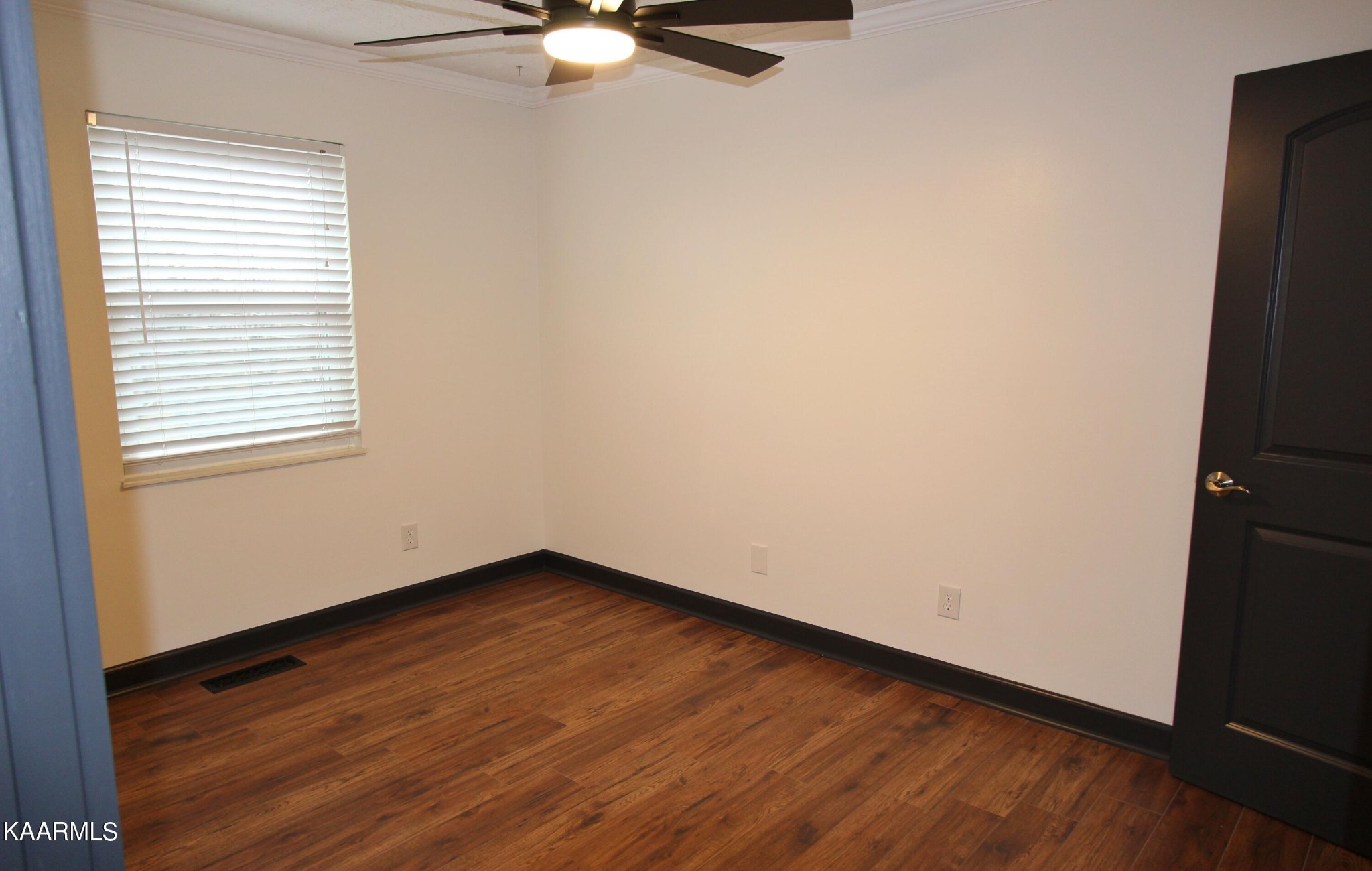 4222 Abercorn Road Knoxville, TN 37921 - Photo 13 of 33 an empty room with wooden floor fan and window