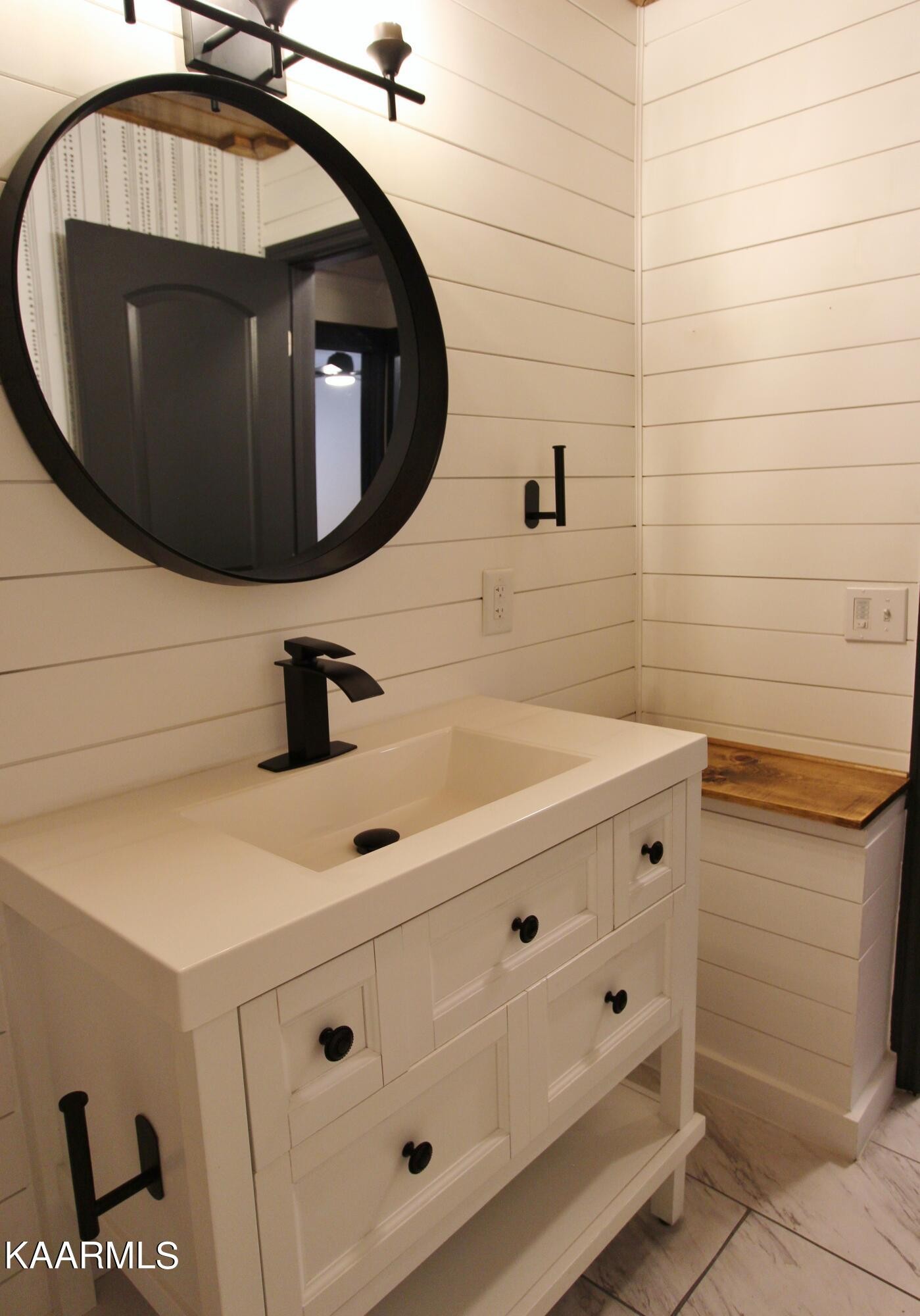 4222 Abercorn Road Knoxville, TN 37921 - Photo 16 of 33 a bathroom with a sink and mirror