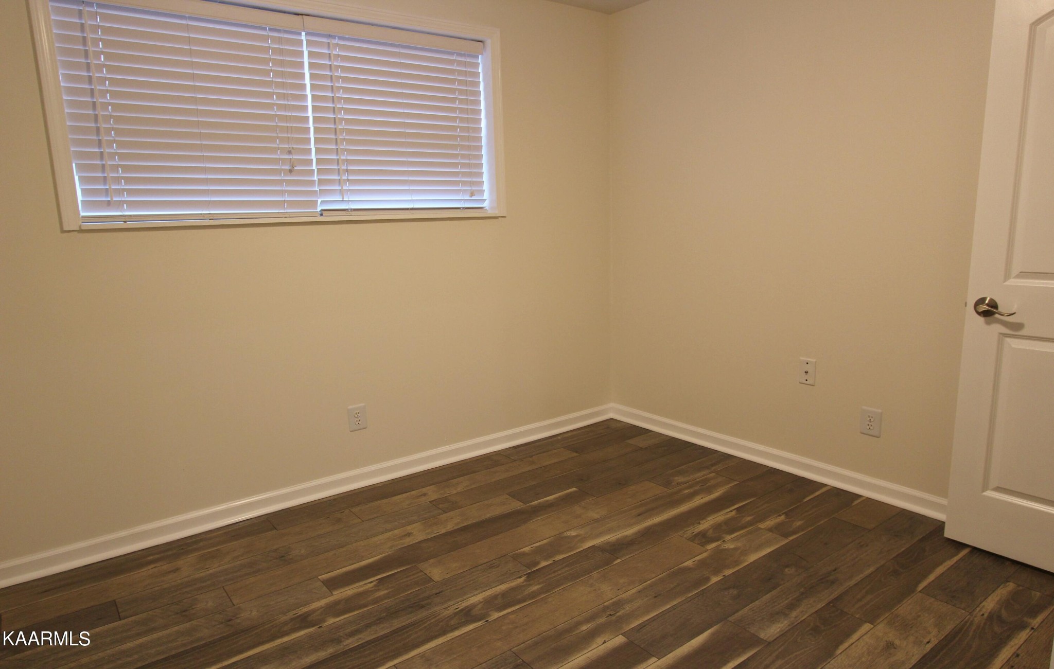 4222 Abercorn Road Knoxville, TN 37921 - Photo 19 of 33 an empty room with wooden floor and a window