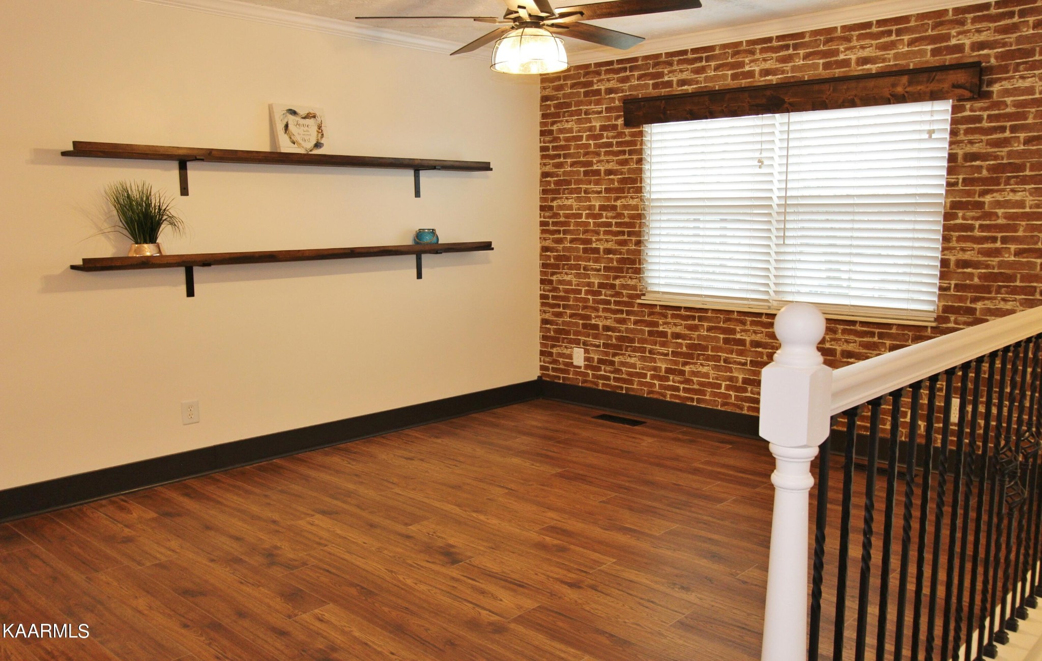 4222 Abercorn Road Knoxville, TN 37921 - Photo 4 of 33 a view of an empty room with a window and wooden floor