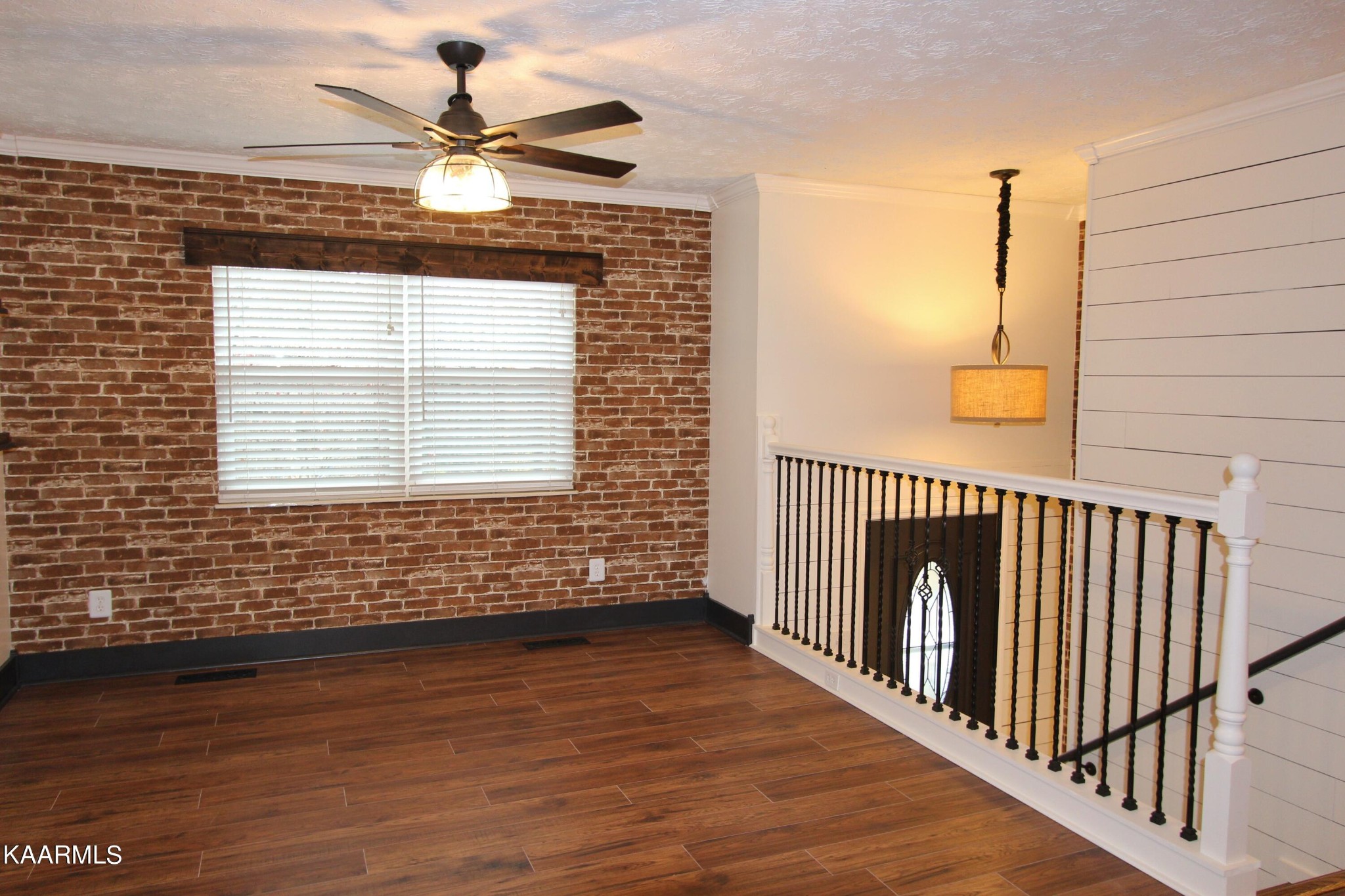 4222 Abercorn Road Knoxville, TN 37921 - Photo 5 of 33 a view of a livingroom with wooden floor