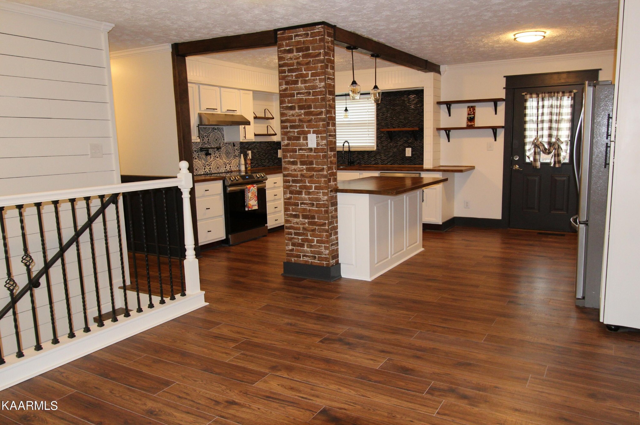 4222 Abercorn Road Knoxville, TN 37921 - Photo 6 of 33 a kitchen with stainless steel appliances a refrigerator and a stove top oven