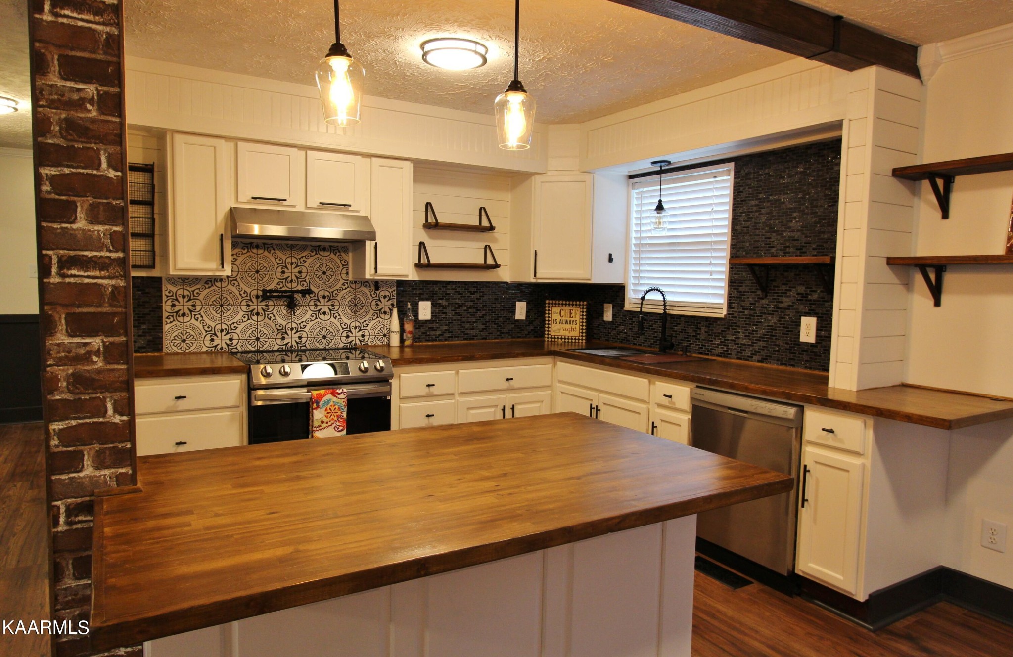 4222 Abercorn Road Knoxville, TN 37921 - Photo 7 of 33 a kitchen with kitchen island a counter top space a sink stainless steel appliances and cabinets