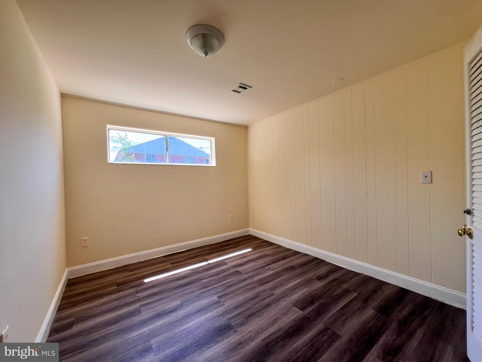 9227 Riggs Road Adelphi, MD 20783 - Photo 46 of 78 a view of room with wooden floor and fan