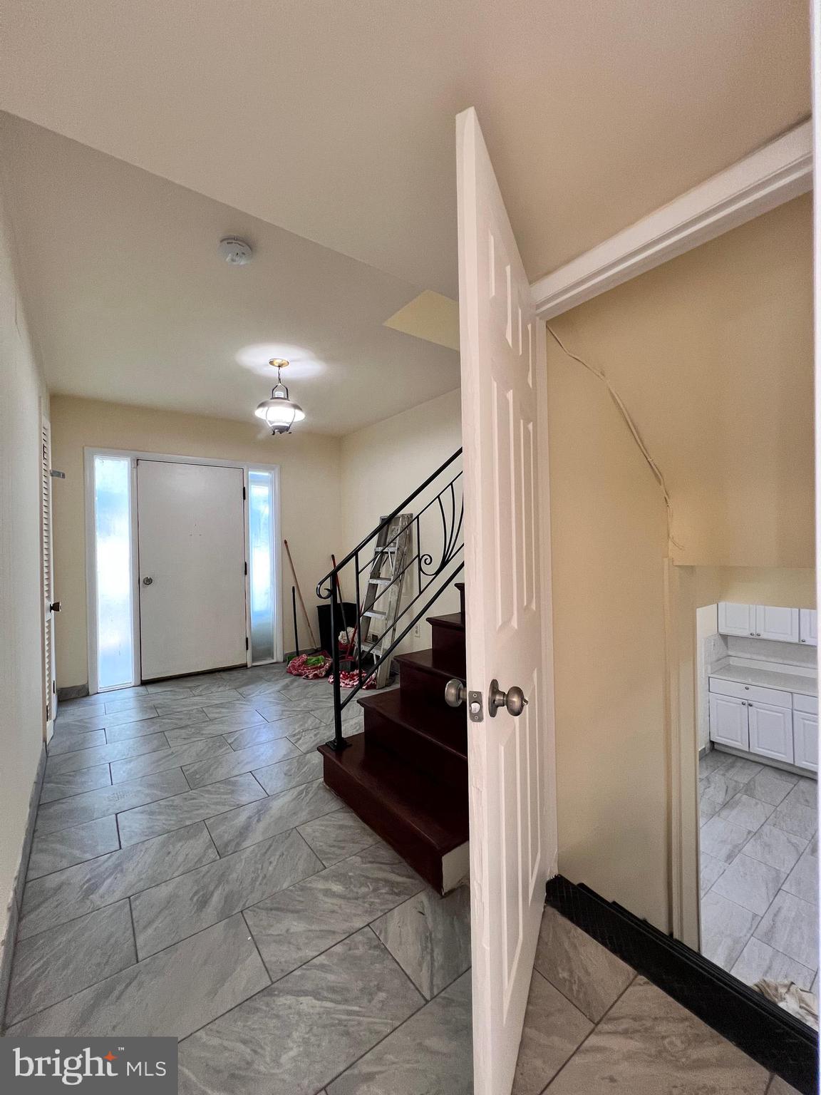 9227 Riggs Road Adelphi, MD 20783 - Photo 59 of 78 Front Entry and stair to lower level