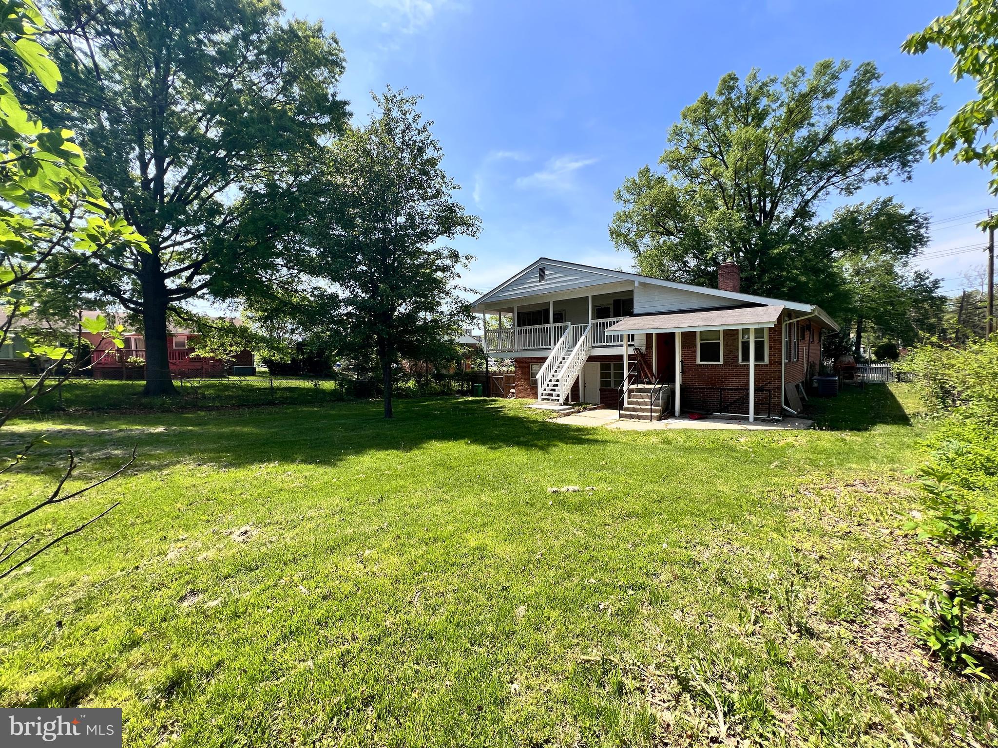 9227 Riggs Road Adelphi, MD 20783 - Photo 68 of 78 a front view of a house with garden