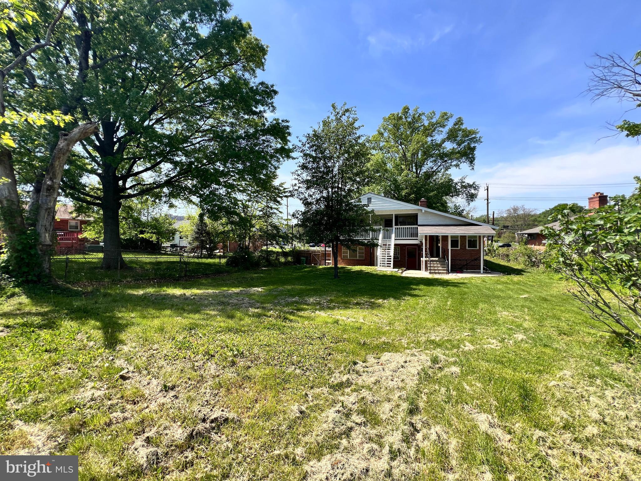 9227 Riggs Road Adelphi, MD 20783 - Photo 69 of 78 a front view of a house with a yard