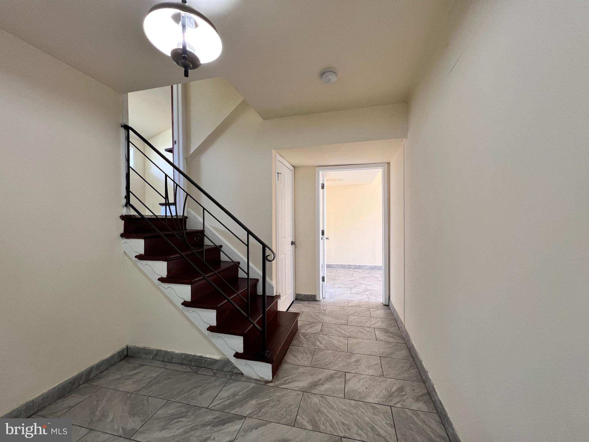 9227 Riggs Road Adelphi, MD 20783 - Photo 8 of 78 Front Entry and stair to Upper level