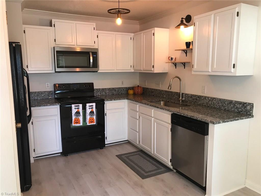 3128 Windchase Court High Point, NC 27265 - Photo 2 of 11 Renovated kitchen with new microwave, floors and granite counter tops.