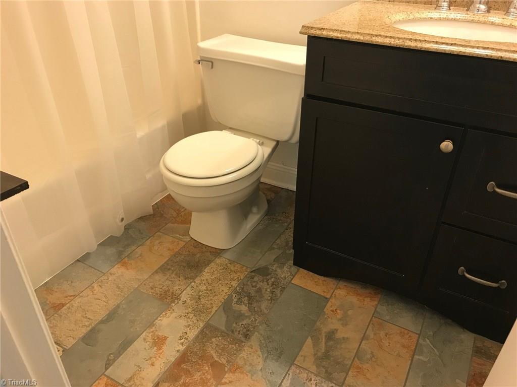 3128 Windchase Court High Point, NC 27265 - Photo 5 of 11 Master bath with new vanity, sink and tile floor.