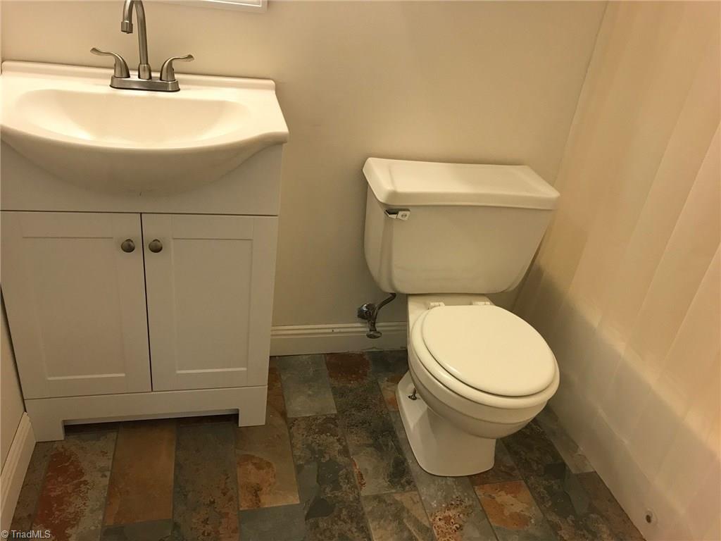 3128 Windchase Court High Point, NC 27265 - Photo 6 of 11 2nd bathroom with new tile floor, vanity and sink.