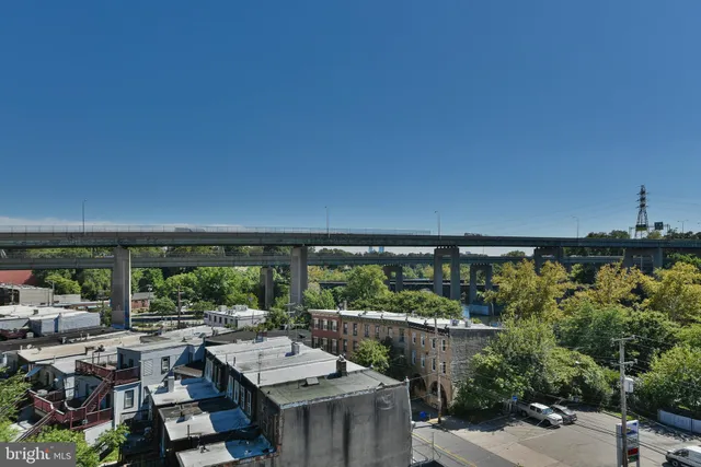 a terrace with outdoor seating and trees