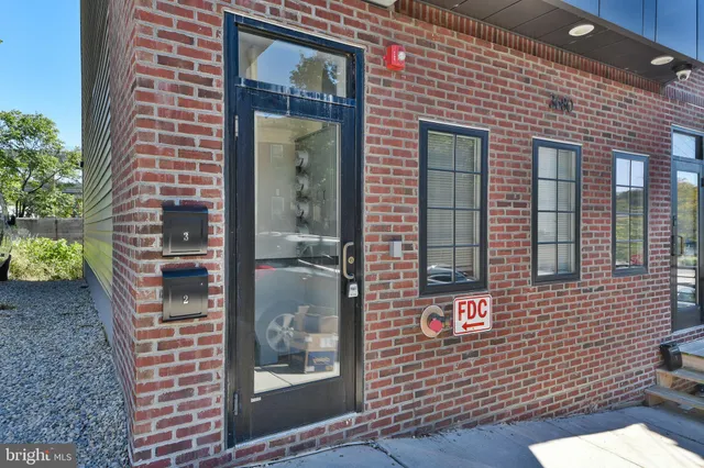 a view of a brick building front of the house