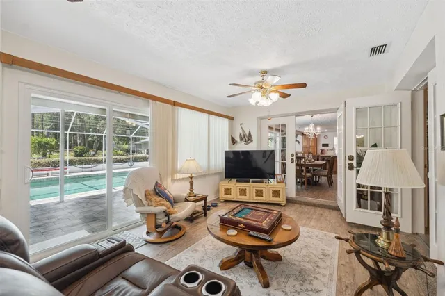 a bathroom with a granite countertop sink mirror and shower