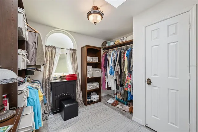 a view of a patio with table and chairs next to a yard
