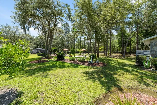a view of a garden with a house