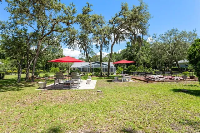 an aerial view of house with yard