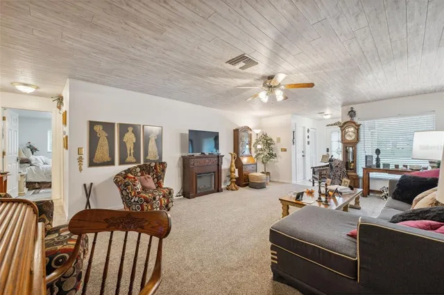 a kitchen with stainless steel appliances granite countertop a refrigerator a sink a stove and dishwasher