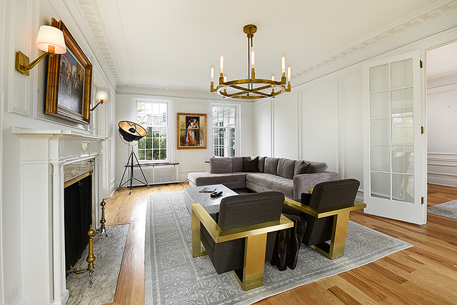 596 Arbor Vitae Road Winnetka, IL 60093 - Photo 12 of 62 a living room with furniture a fireplace and a chandelier