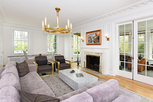 596 Arbor Vitae Road Winnetka, IL 60093 - Photo 13 of 62 a living room with furniture a chandelier and a fireplace