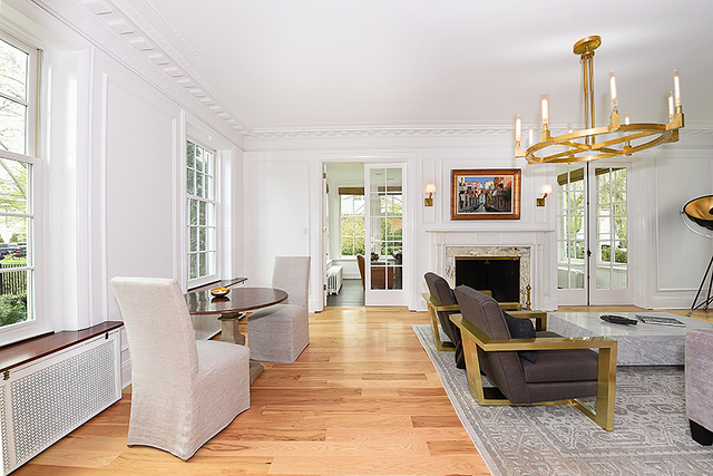596 Arbor Vitae Road Winnetka, IL 60093 - Photo 15 of 62 a living room with furniture and a fireplace
