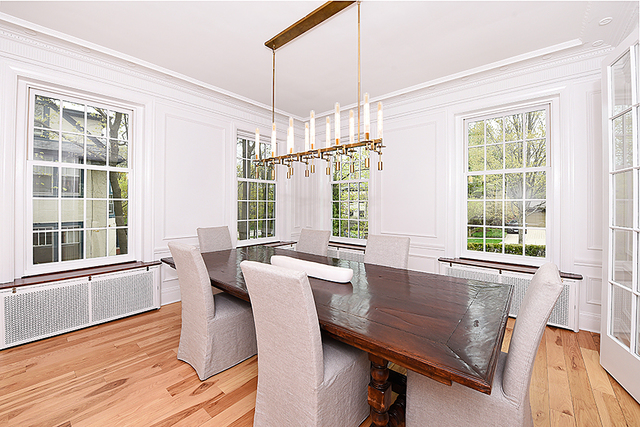 596 Arbor Vitae Road Winnetka, IL 60093 - Photo 19 of 62 a view of a dining room with furniture window and wooden floor