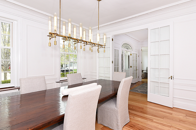 596 Arbor Vitae Road Winnetka, IL 60093 - Photo 20 of 62 a view of a dining room with furniture window and wooden floor