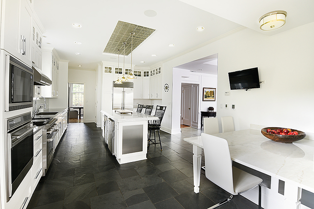 596 Arbor Vitae Road Winnetka, IL 60093 - Photo 23 of 62 a living room with furniture and a flat screen tv
