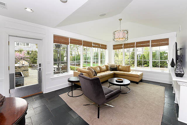596 Arbor Vitae Road Winnetka, IL 60093 - Photo 27 of 62 a living room with furniture and a chandelier