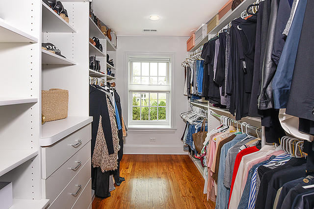 596 Arbor Vitae Road Winnetka, IL 60093 - Photo 37 of 62 a view of walk in closet with clothes and shoes