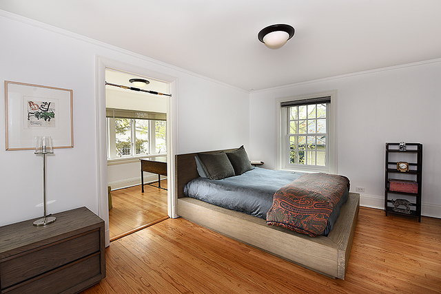 596 Arbor Vitae Road Winnetka, IL 60093 - Photo 40 of 62 a bedroom with a bed and window