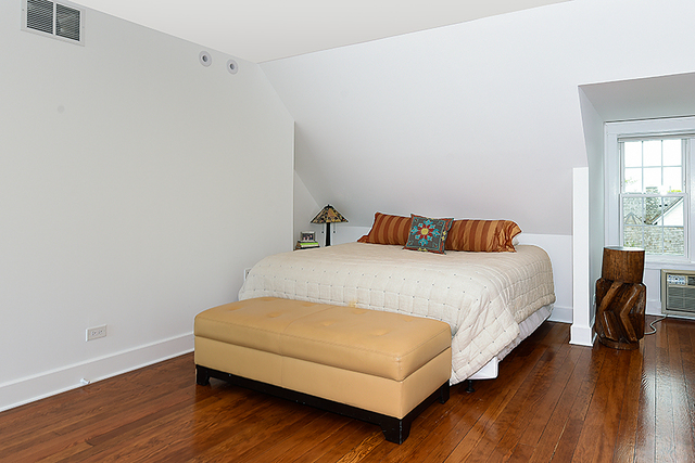 596 Arbor Vitae Road Winnetka, IL 60093 - Photo 43 of 62 a bedroom with a bed and wooden floor