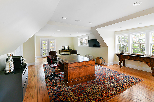 596 Arbor Vitae Road Winnetka, IL 60093 - Photo 53 of 62 a living room with furniture and a flat screen tv
