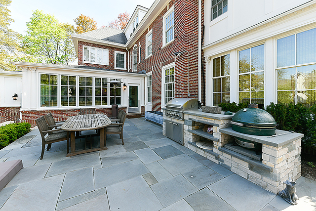 596 Arbor Vitae Road Winnetka, IL 60093 - Photo 57 of 62 a table and chairs in front of a house