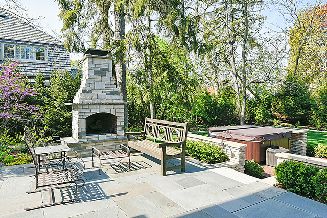 596 Arbor Vitae Road Winnetka, IL 60093 - Photo 58 of 62 a view of house with yard outdoor seating and green space