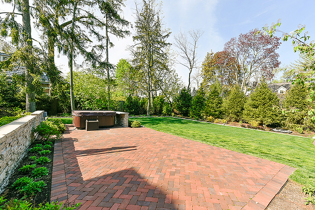 596 Arbor Vitae Road Winnetka, IL 60093 - Photo 61 of 62 a view of backyard with seating area and trees all around