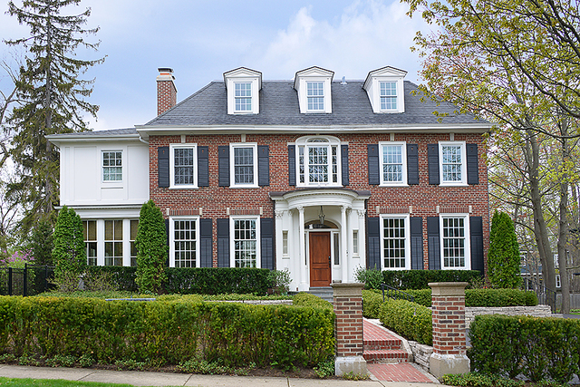 596 Arbor Vitae Road Winnetka, IL 60093 - Photo 62 of 62 a front view of a house with garden
