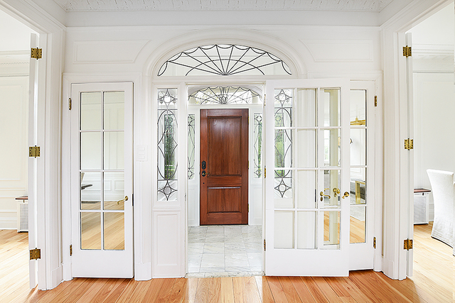 596 Arbor Vitae Road Winnetka, IL 60093 - Photo 8 of 62 a view of a hallway with wooden floor and front door