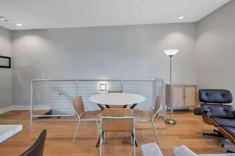 a dining room with a table and chairs
