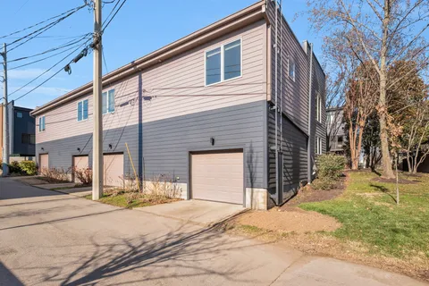 a view of a house with snow on the road