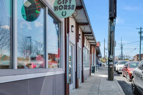 a front view of a house with parking space