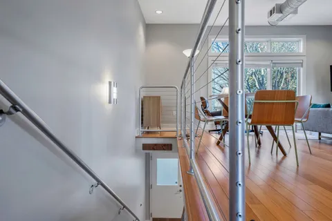 a view of an entryway with wooden floor