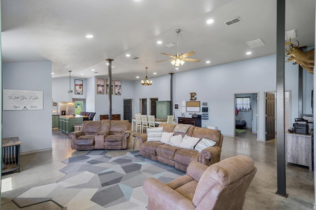1026 VZ County Road Canton, TX 75103 - Photo 7 of 40 a living room with furniture and a chandelier