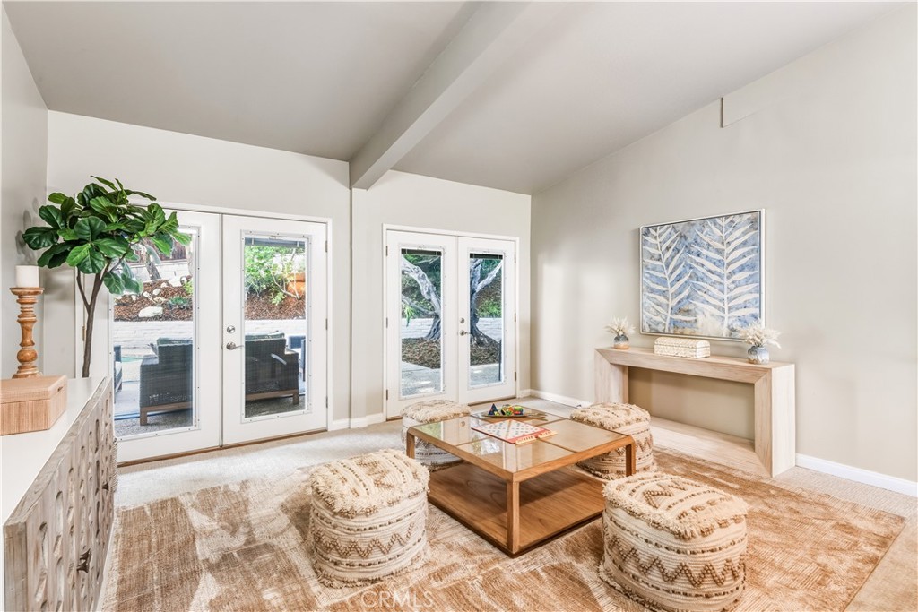 30175 Ave Tranquila Rancho Palos Verdes, CA 90275 - Photo 10 of 35 a living room with a couch and a table