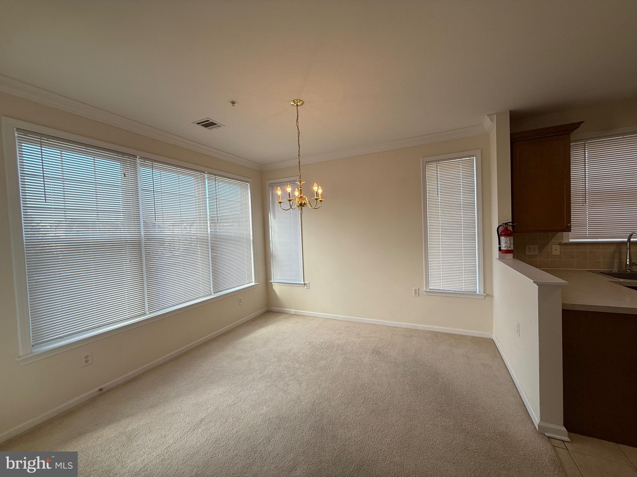 231 Masterson Court Ewing, NJ 08618 - Photo 11 of 43 a view of a kitchen with a sink and dishwasher cabinet
