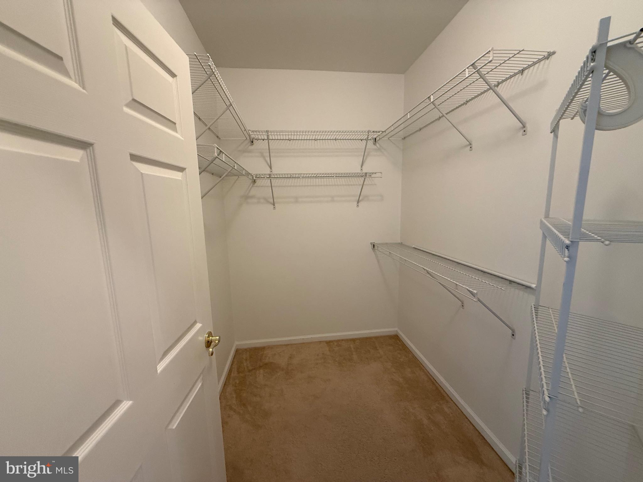 231 Masterson Court Ewing, NJ 08618 - Photo 18 of 43 a view of a room with racks on the wall