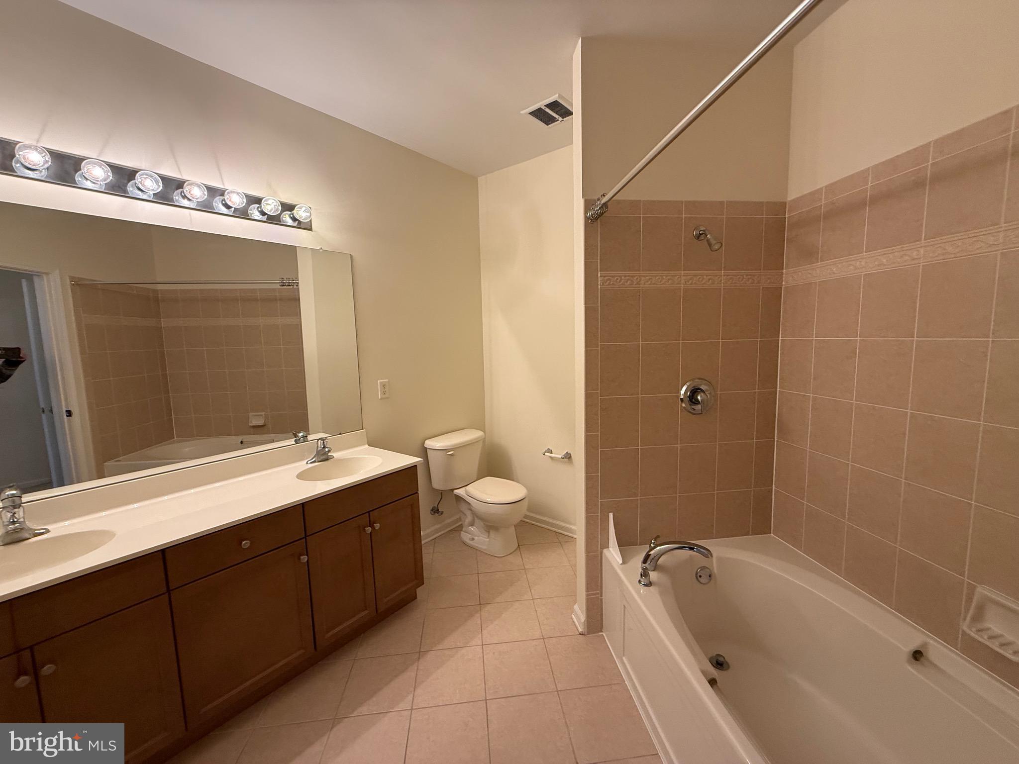 231 Masterson Court Ewing, NJ 08618 - Photo 19 of 43 a spacious bathroom with a double vanity sink toilet mirror and bathtub