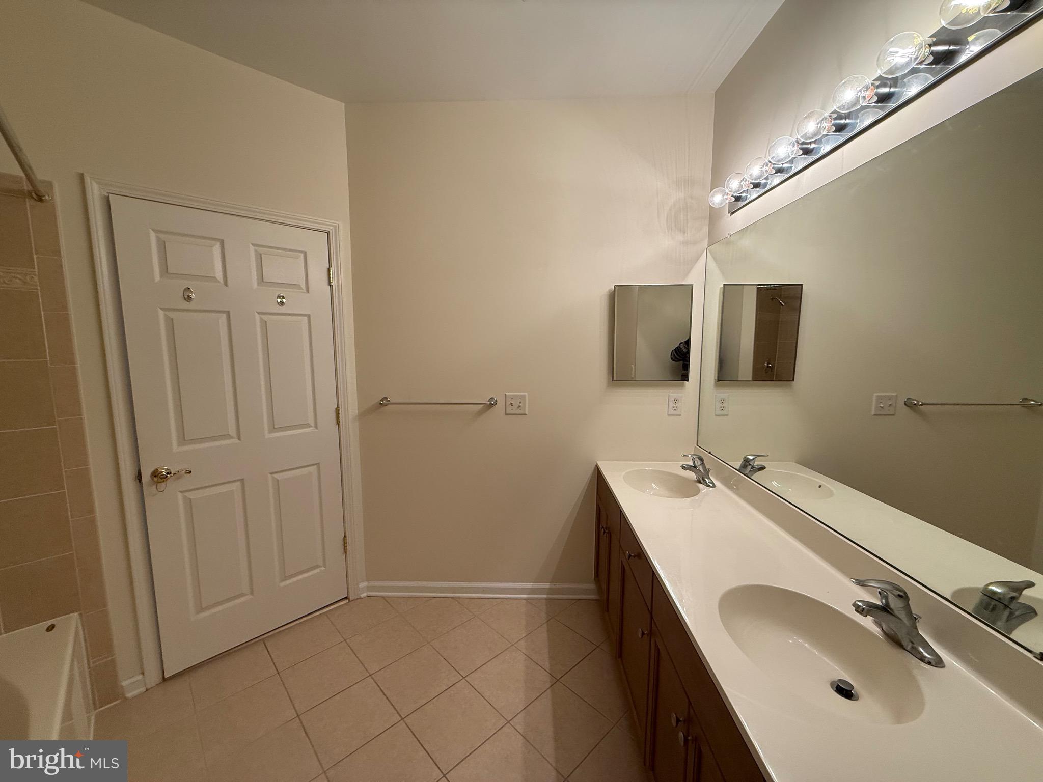 231 Masterson Court Ewing, NJ 08618 - Photo 20 of 43 a bathroom with a double vanity sink a mirror and shower