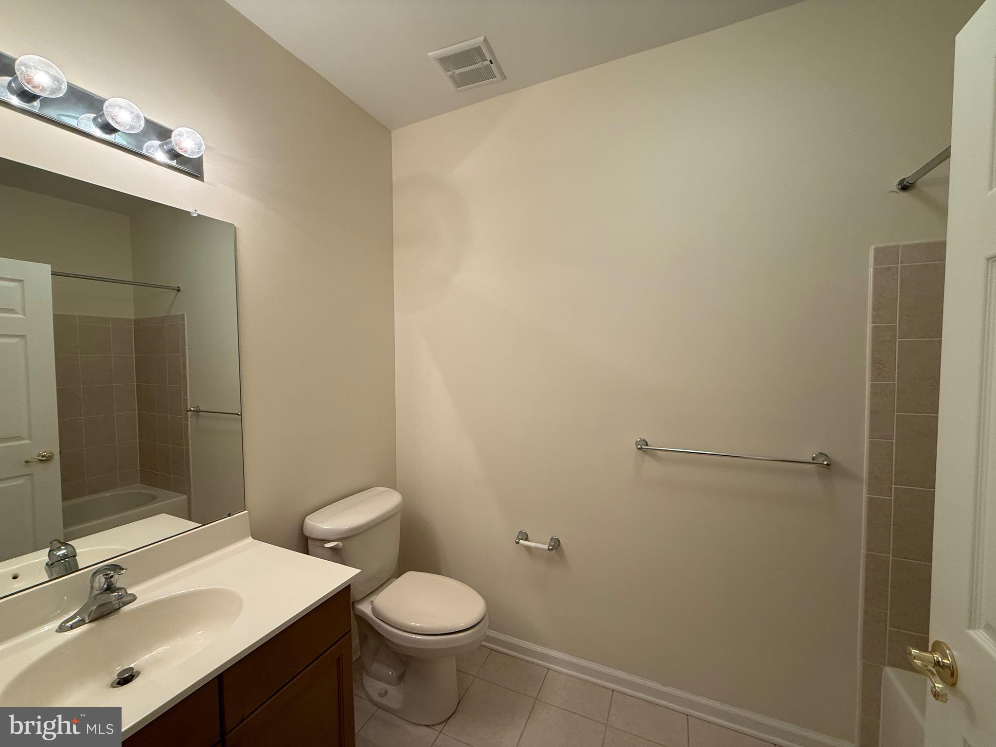 231 Masterson Court Ewing, NJ 08618 - Photo 27 of 43 a bathroom with a sink vanity mirror and toilet